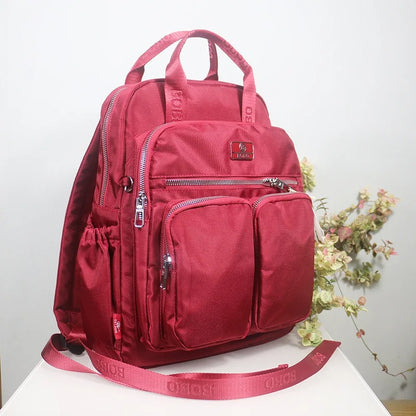 sac a dos de voyage rose en nylon impermeable