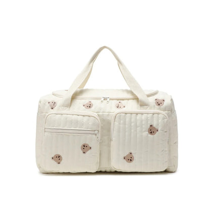 sac de voyage enfant beige avec poignee et bandouliere
