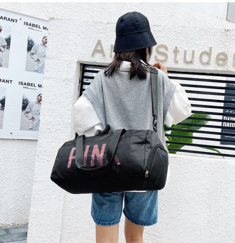 sac de voyage femme avec bandoulere porte epaule. 