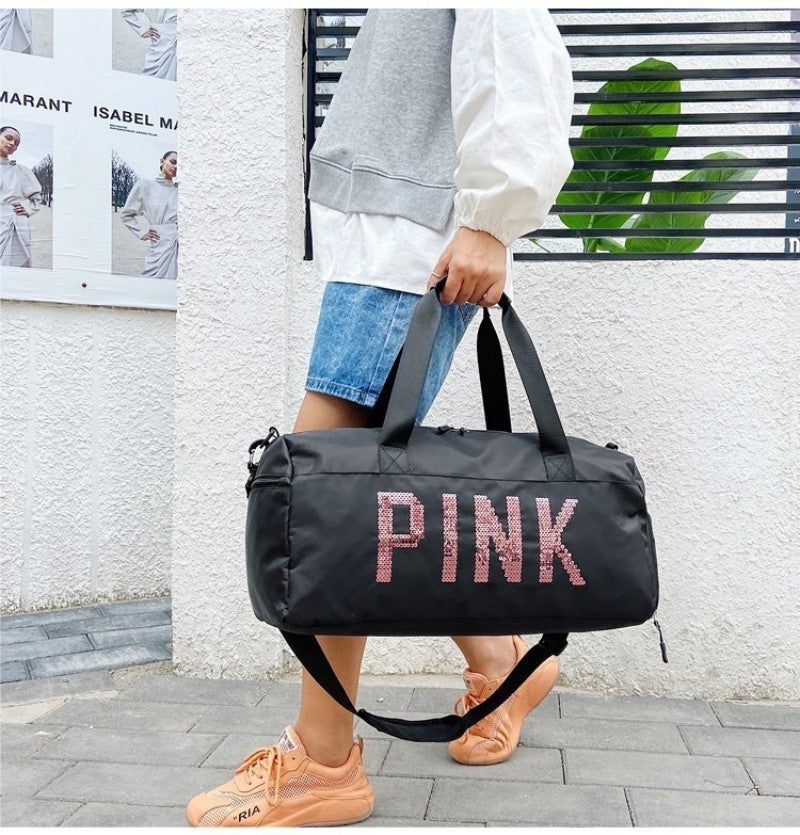 sac de voyage femme noir PINK ecrit en paillete rose porte a la main