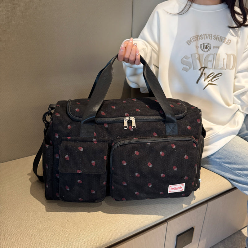 sac de voyage femme noir motifs fraises