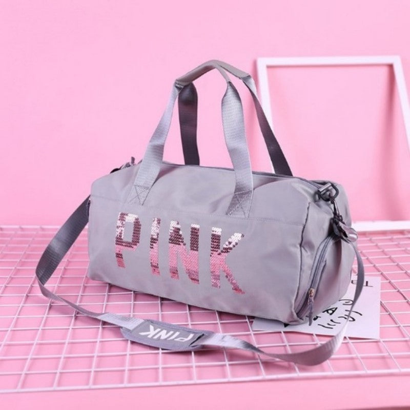 sac de voyage femme violet pink ecrit en paillete rose