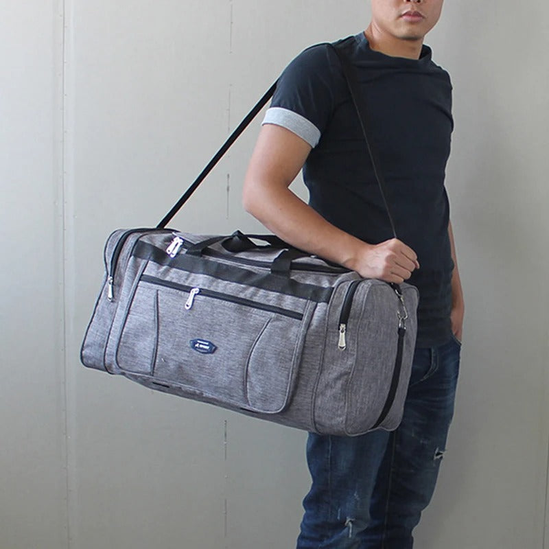 sac de voyage homme gris avec sangle epaule