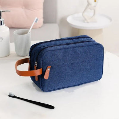trousse de toilette de voyage pour homme bleue poignée marron
