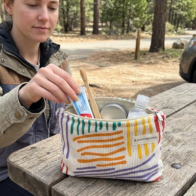 Trousse de voyage tissu en velours côtelé à rayures colorées